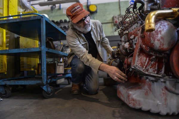Mike Nelson at work on his latest installation in a mechanical workshop
